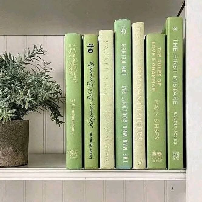 moodboard image displaying a shelf of green books